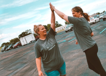 OakStar Bank team members giving a high five