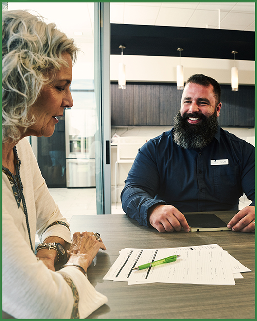 An OakStar Bank team member helping a customer transition banking relationships.