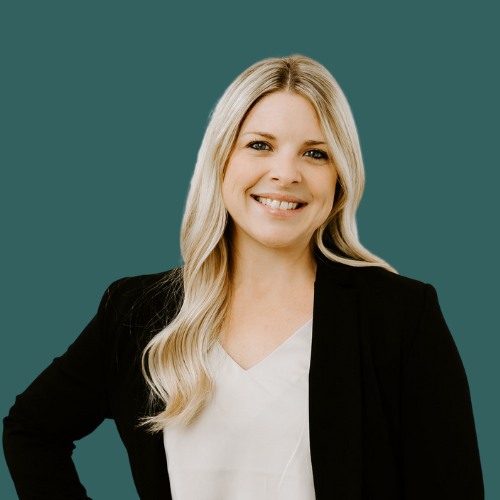 Headshot of a woman in a blazer.
