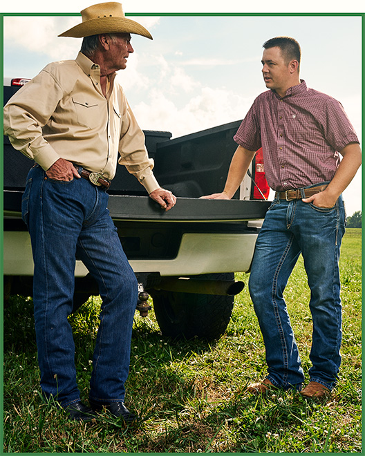 Farmers exploring agricultural lending solutions with OakStar Bank.