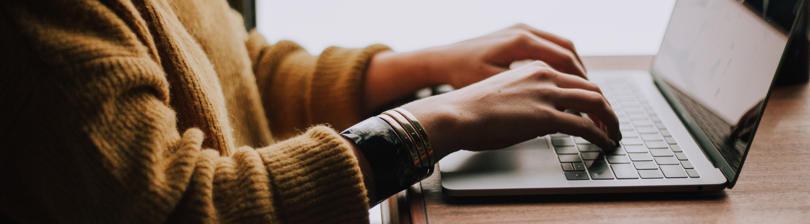 Woman typing on laptop