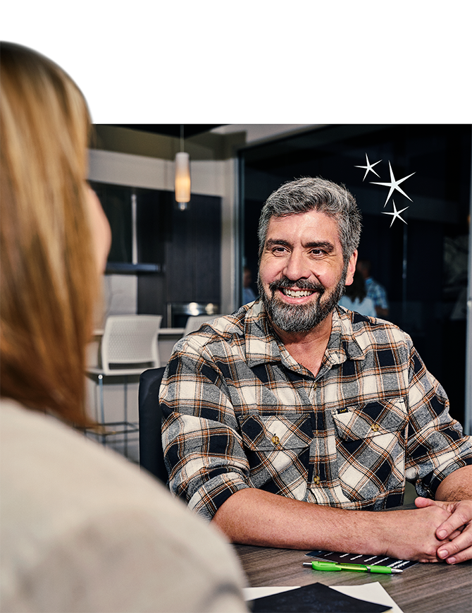 A customer receiving banking assistance from an OakStar Bank team member.