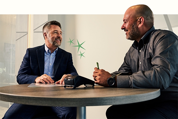 An OakStar Bank team member discussing business banking solutions with a customer.