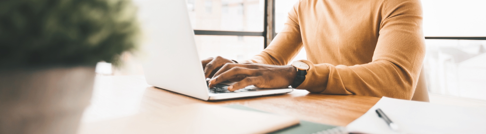 Man typing on laptop