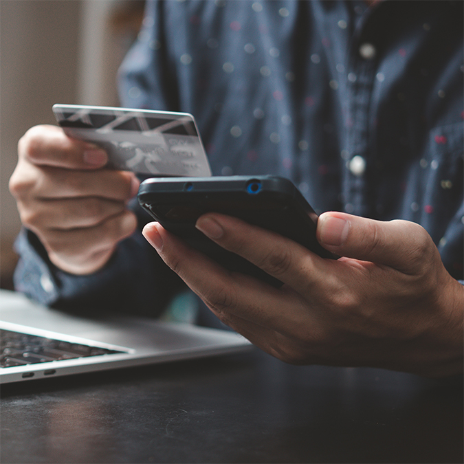 A business owner managing payments and account controls to reduce fraud risk.