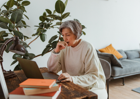 Woman working on her laptop in the living room