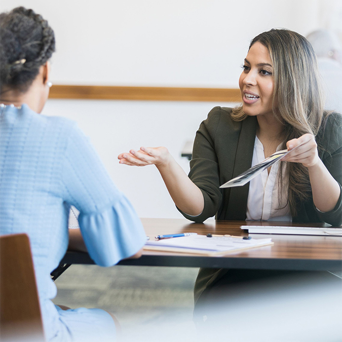 A customer discussing home financing options with an OakStar Bank lender.