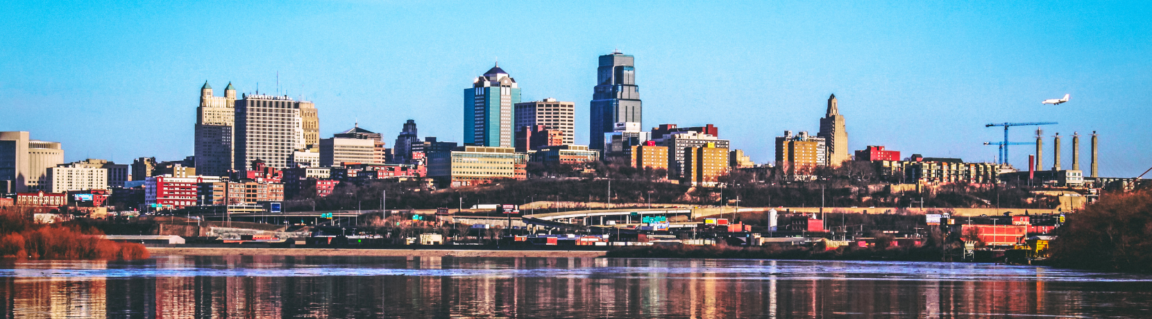A landscape image of a city and river.
