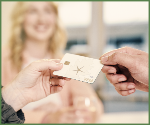 A customer earning rewards with an OakStar Bank debit card purchase.