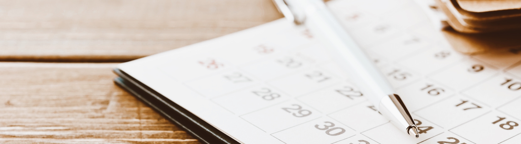 Calendar with a pen on a desk