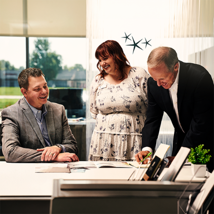 OakStar Bank team members discussing SBA lending expertise and business financing.