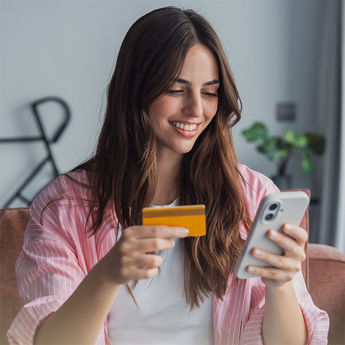 A customer using OakStar Bank personal digital banking on a smartphone.