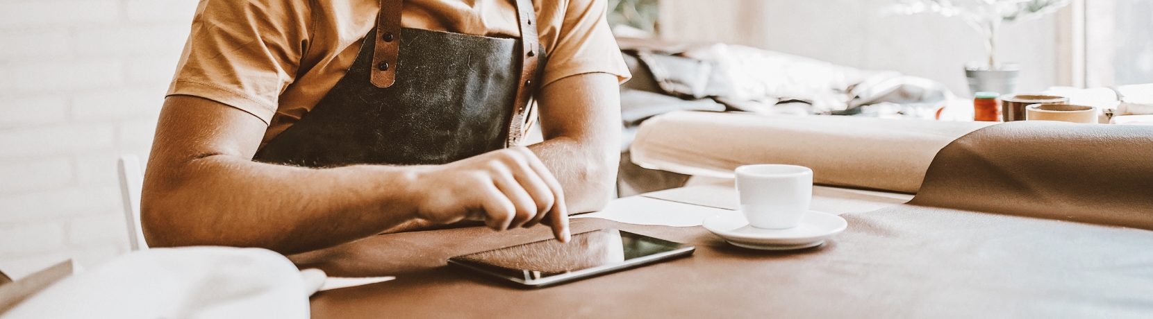 Small business owner working on his ipad