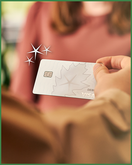 A customer using an OakStar Bank Visa debit card to save with Pocket Change.