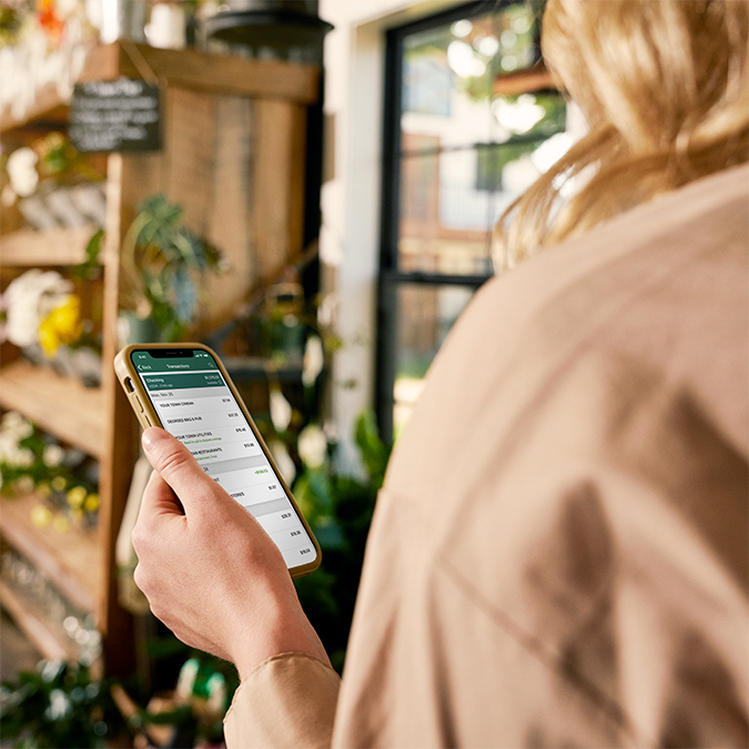 A customer managing finances with the OakStar Bank mobile app.